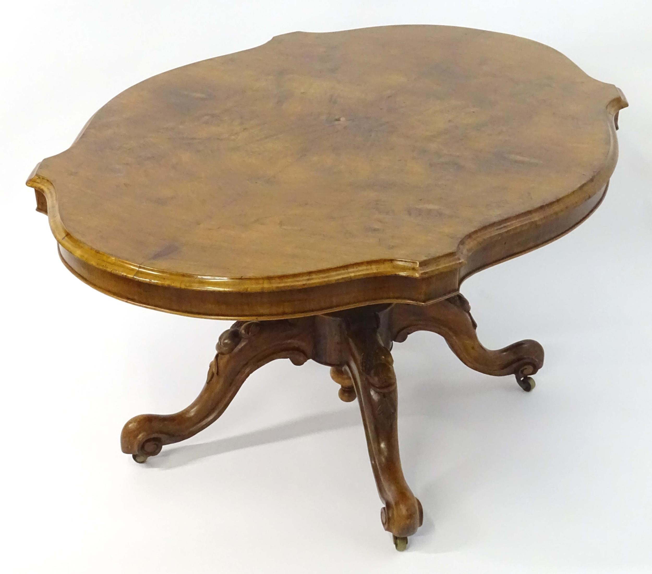 A mid 19thC walnut loo table with a burr walnut veneered top above a turned pedestal base and four - Image 6 of 12