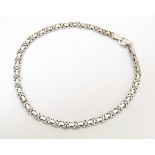 A 9ct white gold link bracelet. Approx. 7 1/2" long Please Note - we do not make reference to the