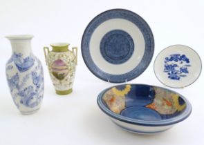 A quantity of Oriental items to include a blue and white plate decorated with a landscape scene, a