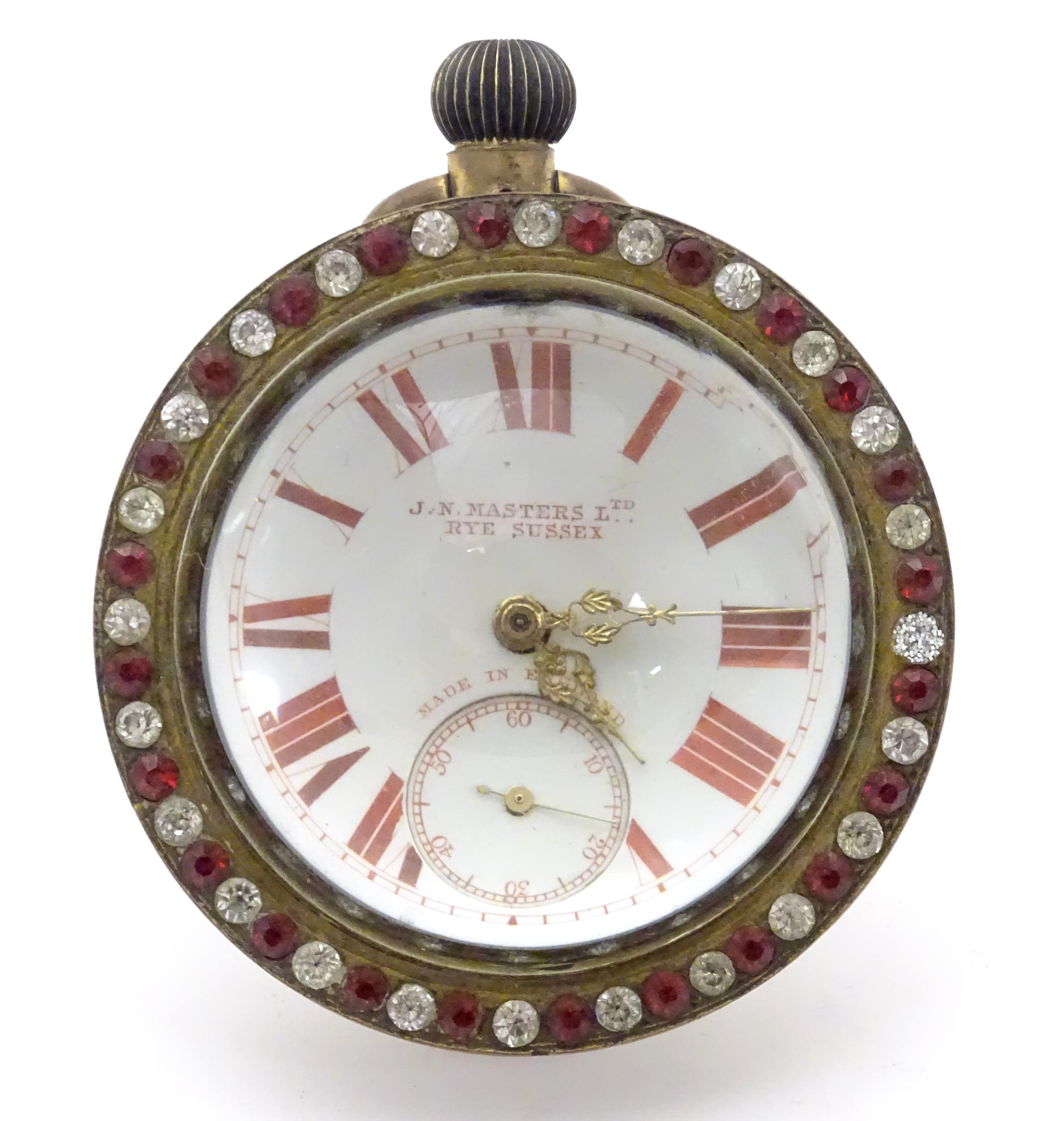 A bulls eye pocket / desk watch, the dial signed J. N Masters Ltd. Rye Sussex the surround decorated