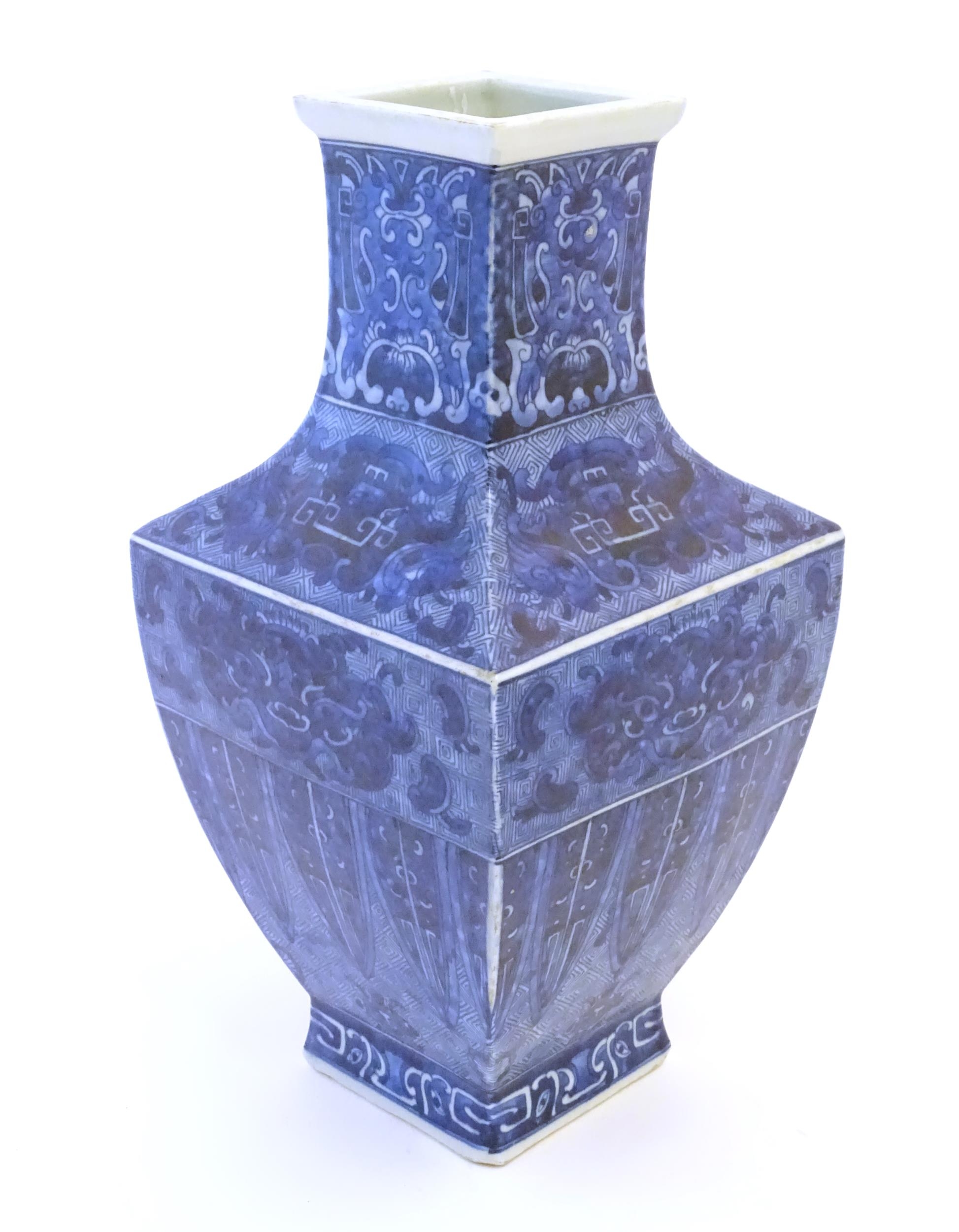 A Chinese blue and white vase of squared form decorated with stylised masks, banded detail and - Image 4 of 7