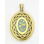Mourning / memorial jewellery : A yellow metal locket of pendant form with forget-me-not blue and