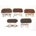 A quantity of early 20thC spectacles / glasses, comprising five pairs, one pair with faux