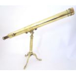 A Victorian brass two-drawer telescope on stand, the tripod base with hinged legs and adjustable