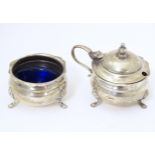 An early 20thC Indian silver two piece cruet comprising salt and mustard pot, maker Warner