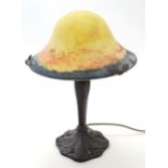 An 20thC table lamp in the Art Nouveau style with glass shade in the French style. 18 1/2" high