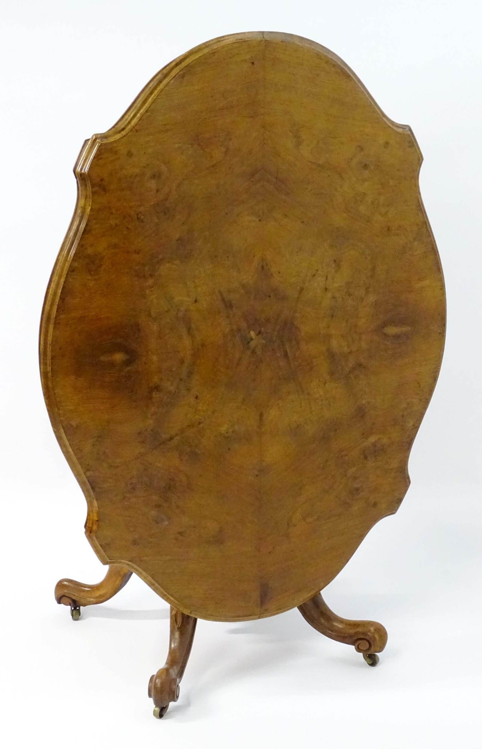 A mid 19thC walnut loo table with a burr walnut veneered top above a turned pedestal base and four - Image 10 of 12