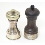 Two pepper mills / grinders, one with silver mount hallmarked London 1989 maker Asprey & Co Ltd ,