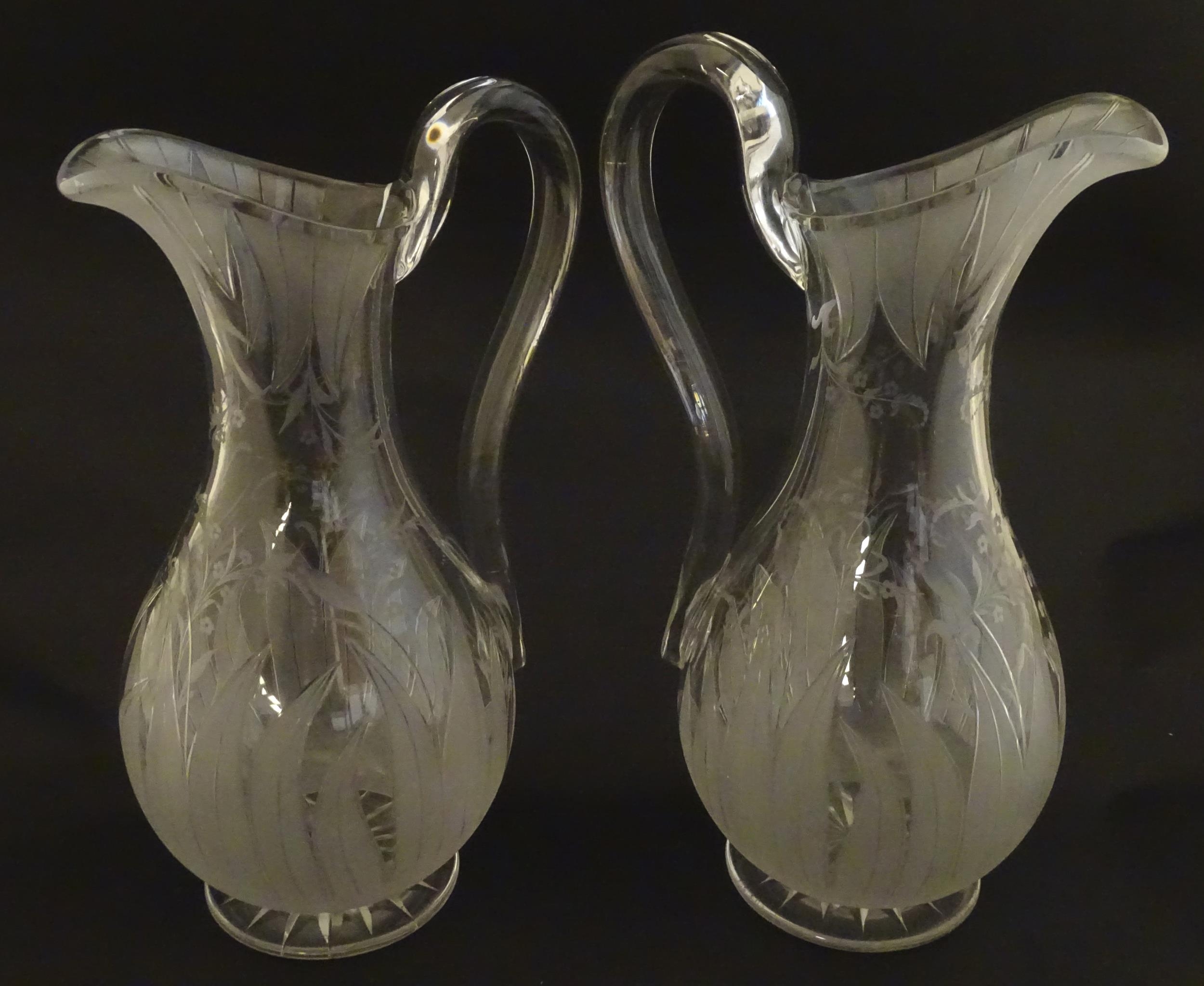 A pair of 19thC jugs with etched decoration depicting floral and foliate detail probably by - Image 4 of 9