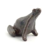 A cold painted bronze model of a seated frog. Approx. 1 1/4" high Please Note - we do not make