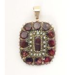 A Victorian yellow metal pendant set with garnets and seed pearls, engraved Charlotte Hill to