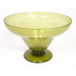 A green glass pedestal bowl with bubble inclusions. Approx 11 1/2" diameter x 7 1/2" high Please