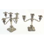 A silver plate table candelabrum with five sconces, together with another with three sconces, both