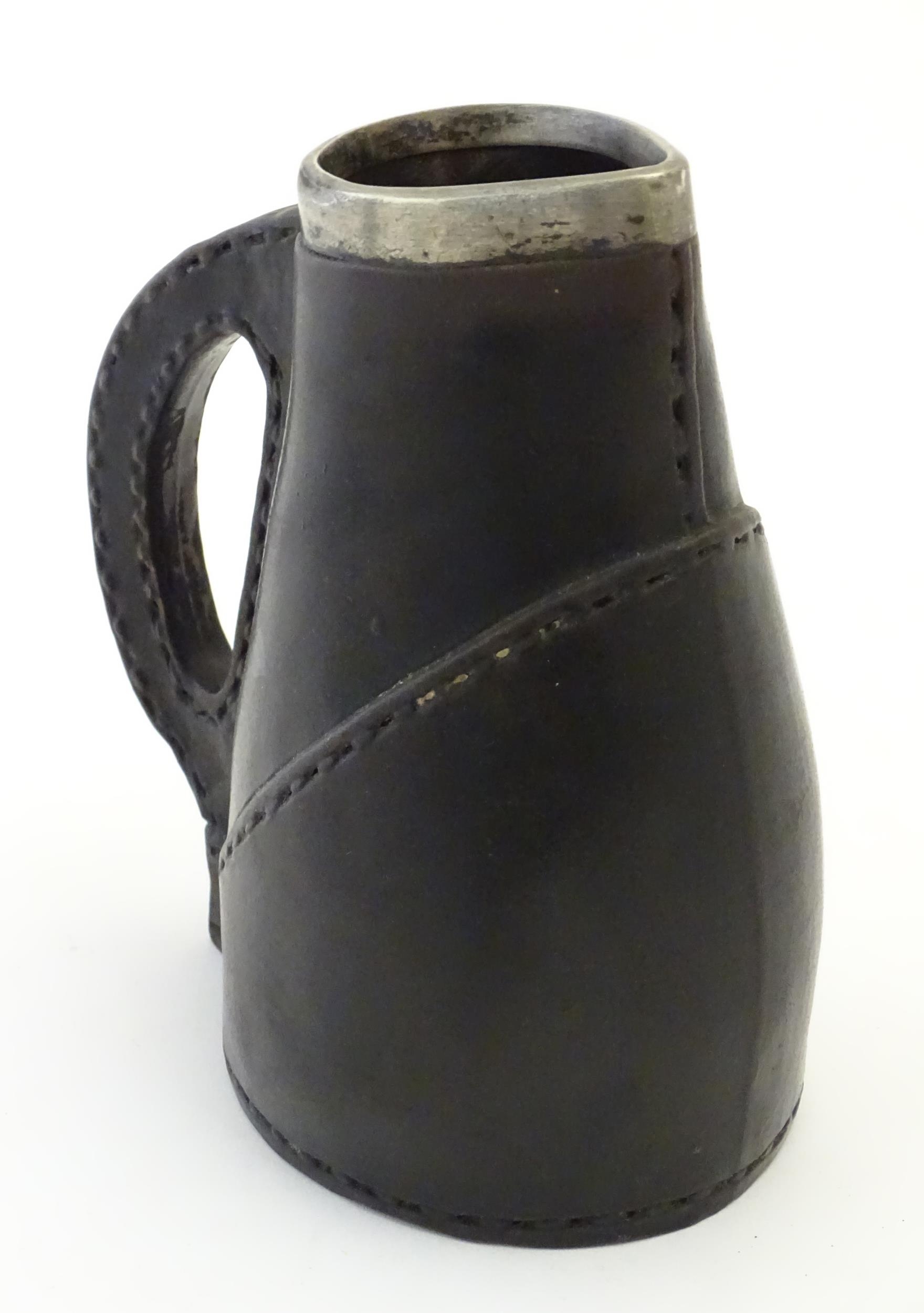 A Victorian Doulton Lambeth pottery jug formed as a leather jack with a silver rim hallmarked London - Bild 3 aus 7