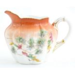 A Wileman Foley China jug with floral and foliate detail. Marked under. Approx. 3 1/2" high Please