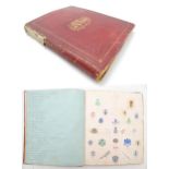 A late 19th / early 20thC album / scrapbook containing various printed / embossed paper monograms,