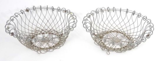 A pair of 19thC wirework planters / baskets with scrolling detail. Each approx. 24" in diameter x
