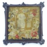 A 19thC needlework embroidery depicting an architectural structure with a border of flowers and