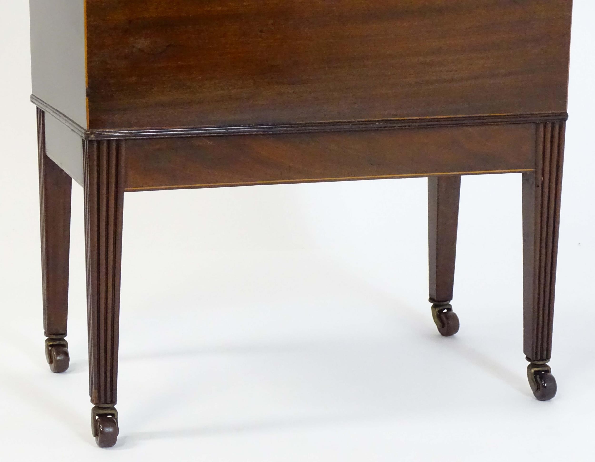 A George III mahogany domed lidded cellarette fitted with dividers for eight bottles, flanked by - Image 9 of 10