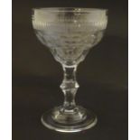 A late 18thc sweetmeat / champagne glass with facet cut detail. 6 1/4" high Please Note - we do