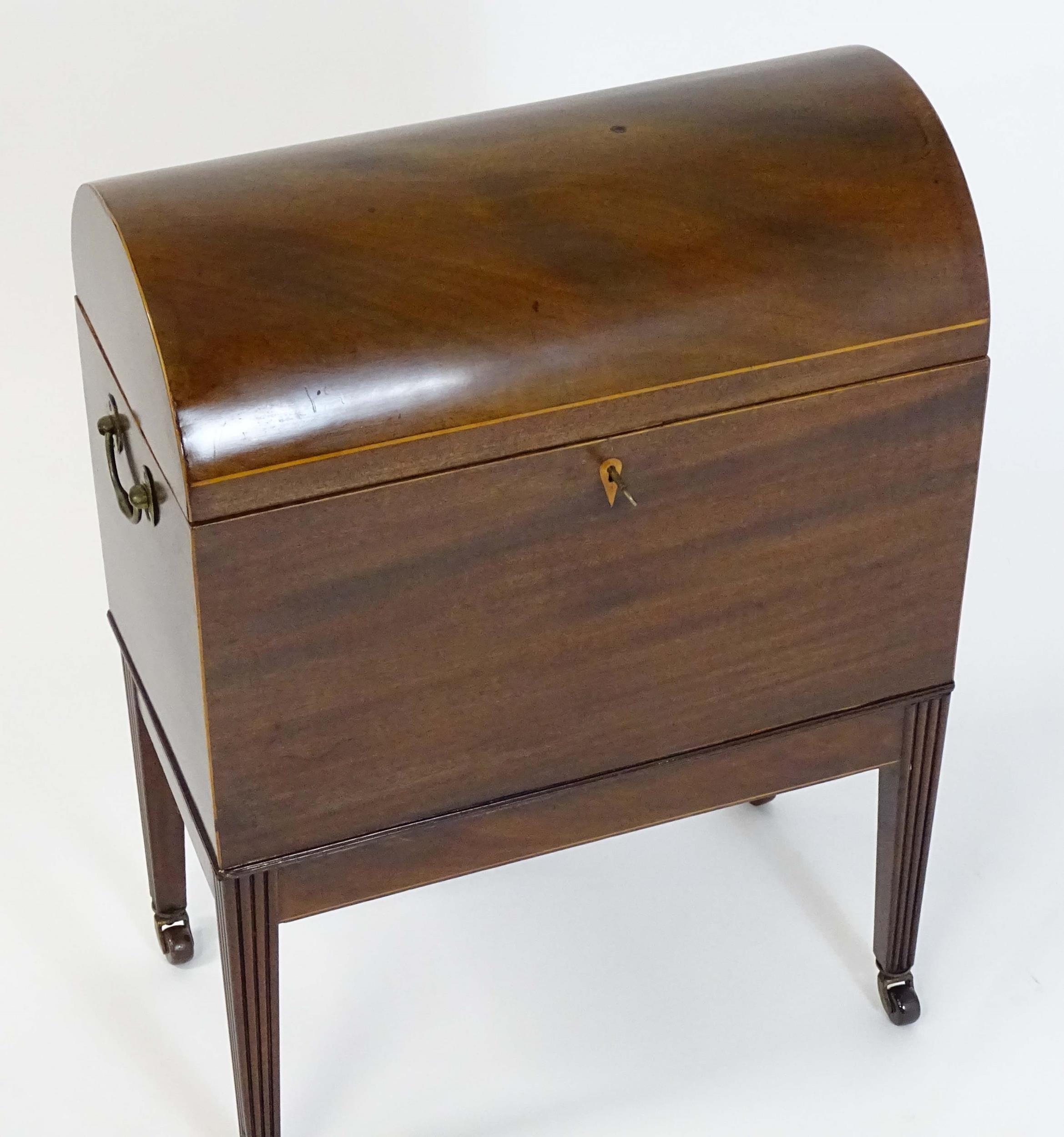 A George III mahogany domed lidded cellarette fitted with dividers for eight bottles, flanked by - Image 10 of 10