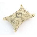 A sewing / needlework pin cushion with cut steel pin decoration, banded border, foliate detail,