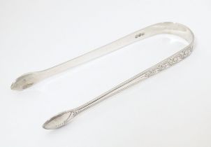 George III silver bright cut sugar tongs, hallmarked London 1799, maker Peter and Ann Bateman