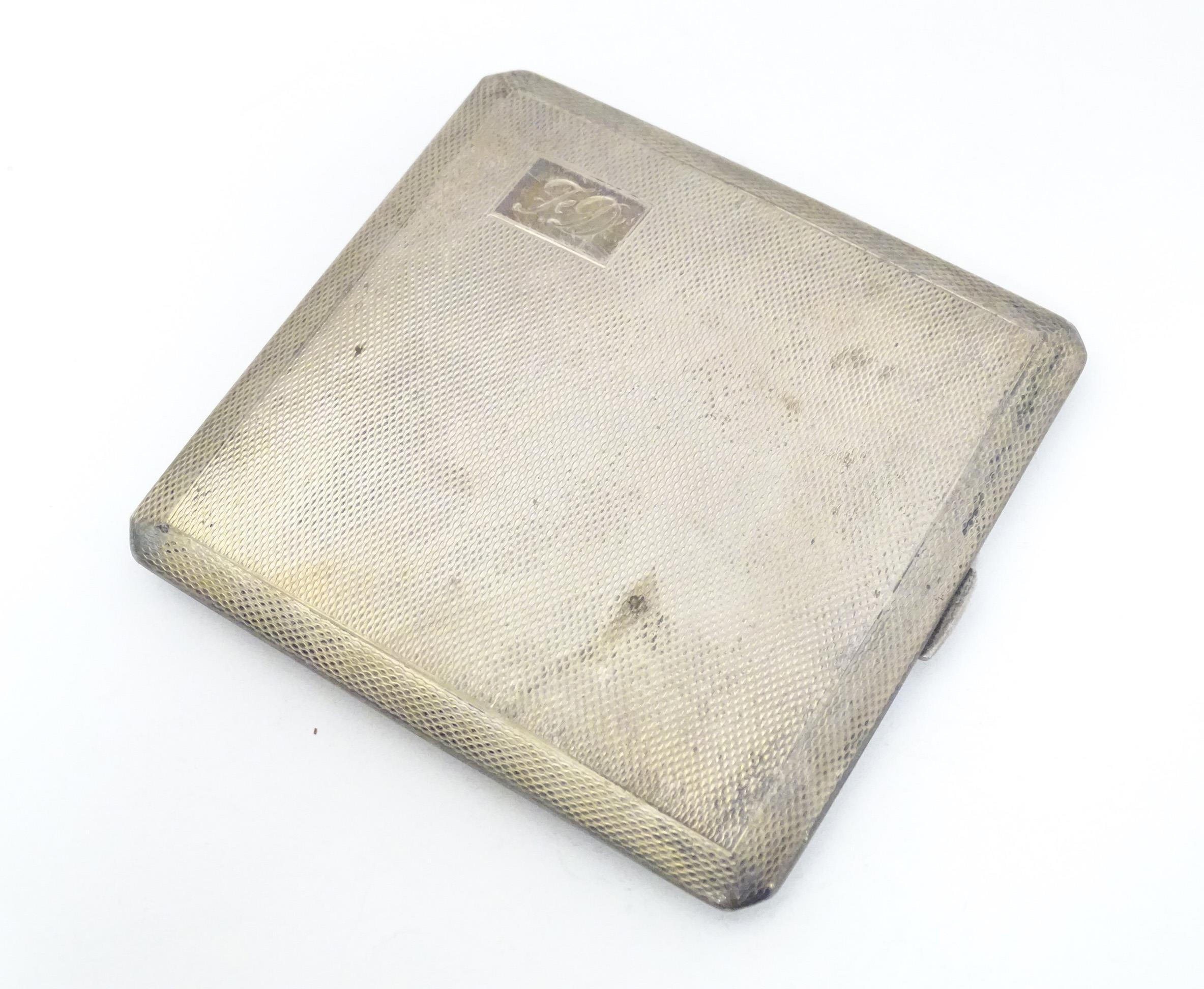 A silver cigarette case with engine turned decoration and gilded interior, hallmarked Birmingham - Image 2 of 10