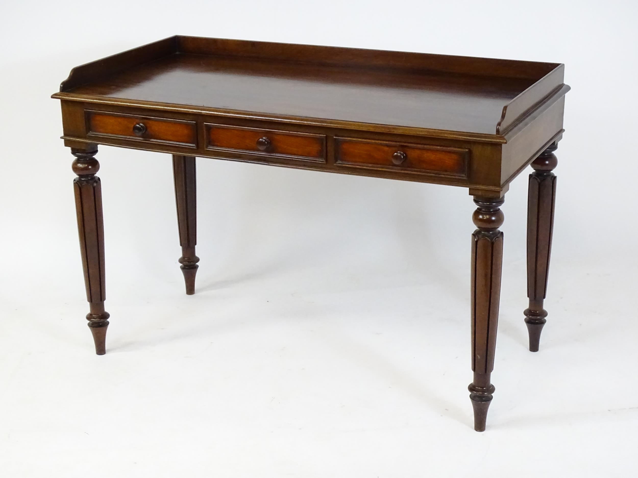 A Regency period mahogany dressing table with a shaped upstand above three shaped drawers and raised - Image 5 of 7