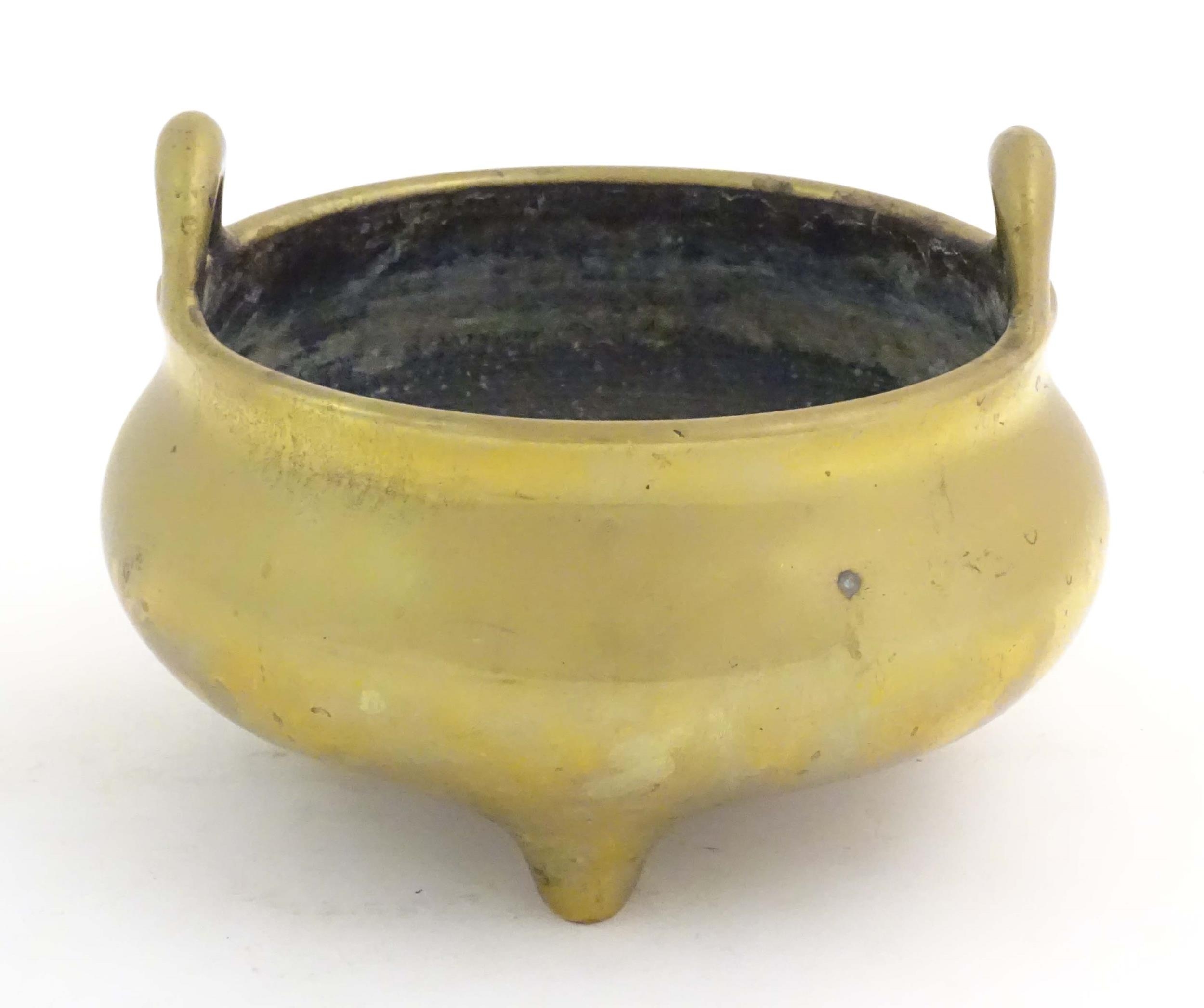 An Oriental three footed censer with twin handles. Character marked under. Approx. 5" high Please - Image 4 of 8