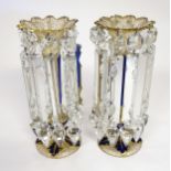 A pair of Victorian glass table lustres with blue and gilt detail. Approx 12" high Please Note -