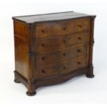 A mid 19thC walnut continental commode, having a patch veneered top with castellated corners above