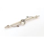 A 15ct gold bar brooch set with pearl and diamonds. Approx. 2" long Please Note - we do not make