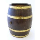 An early 20thC oak coopered barrel with brass banding. Approx. 17" high Please Note - we do not make