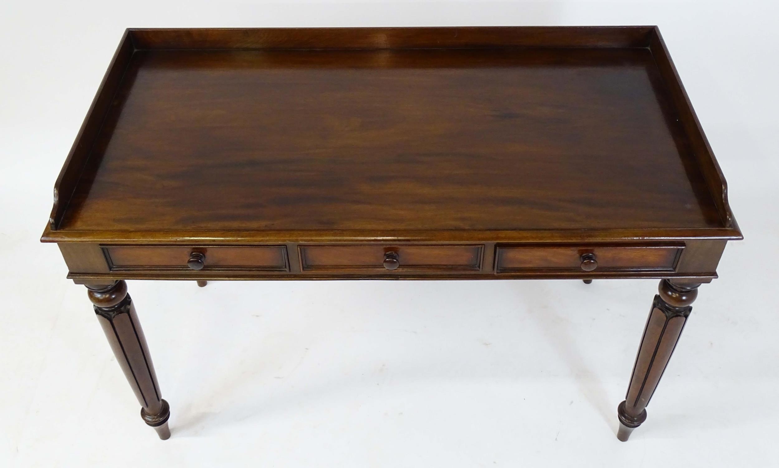 A Regency period mahogany dressing table with a shaped upstand above three shaped drawers and raised - Image 4 of 7