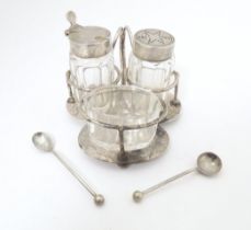 A silver cruet stand with salt, mustard and pepper, hallmarked London 1904, maker Hukin & Heath