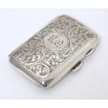 A silver cigarette case with engraved decoration, hallmarked Birmingham 1919, maker Joseph Gloster