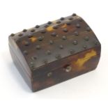 A 19thC miniature tortoiseshell box with stud detail to top. Approx. 1 1/4" high x 2 1/4" wide x 1