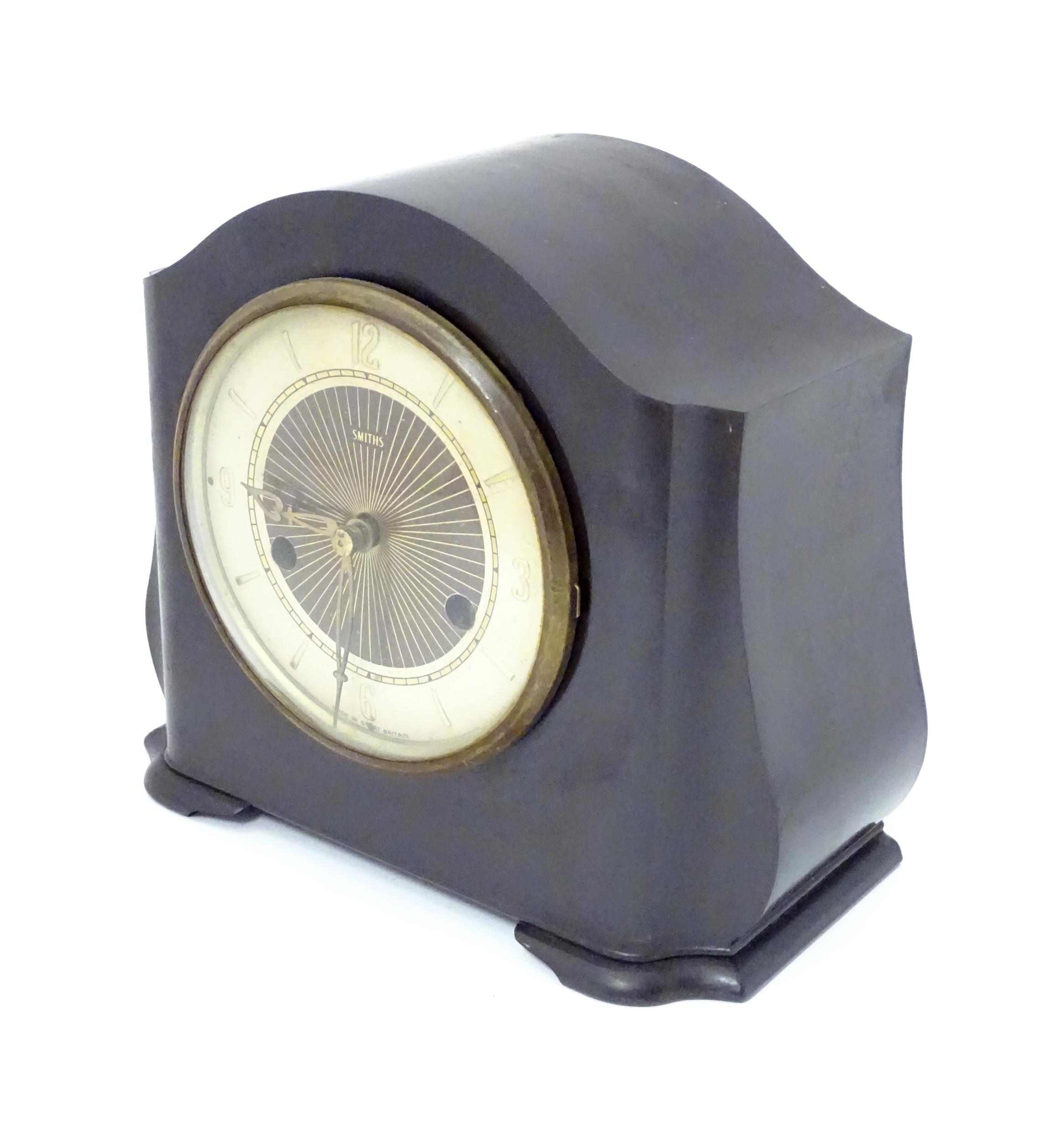 A Bakelite cased mantel clock by Smiths. 7 1/4" high Please Note - we do not make reference to the - Image 4 of 13