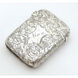 A Victorian silver vesta case with engraved foliate decoration, hallmarked Birmingham 1893, maker