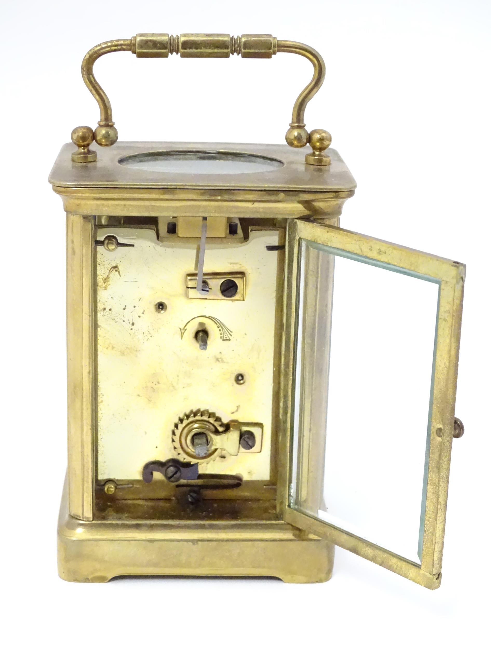 A carriage clock with brass case and enamel dial. Approx. 5 1/2" high overall. Please Note - we do - Image 9 of 13
