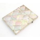 A Victorian mother of pearl card case with floral and foliate decoration. Approx. 4" x 3" Please