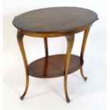 An early 20thC Art Nouveau style occasional table with an oval top and leaf detailing to the