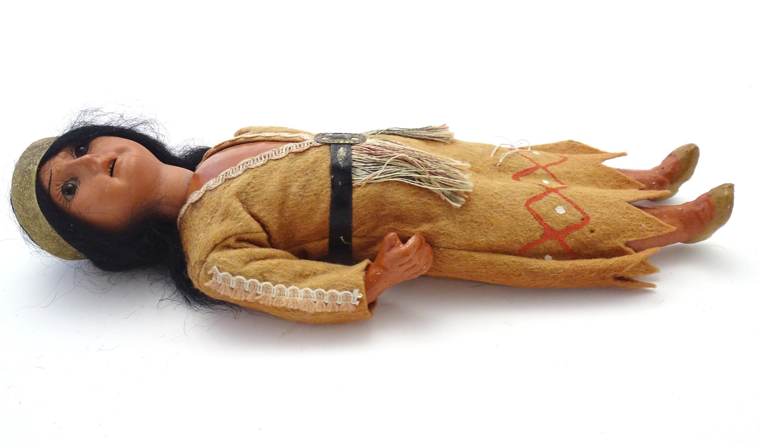 Toy: A 20thC Continental doll modelled as a Red Indian woman, possibly Pocahontas. With a bisque - Image 4 of 12