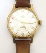 A mid 20thC wrist watch by Smiths , de luxe model A456 , fitted with a leather strap. Please