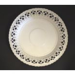 A Leeds Pottery creamware plate with a pierced border. Impressed marks under. Approx. 8 1/4"