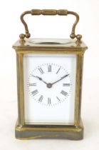 A carriage clock with white enamel dial. 5 3/4" high 'overall. Please Note - we do not make