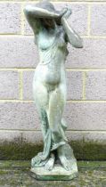 A late 20thC reconstituted stone garden figure of a classical maiden, standing 46" high, 14" wide,