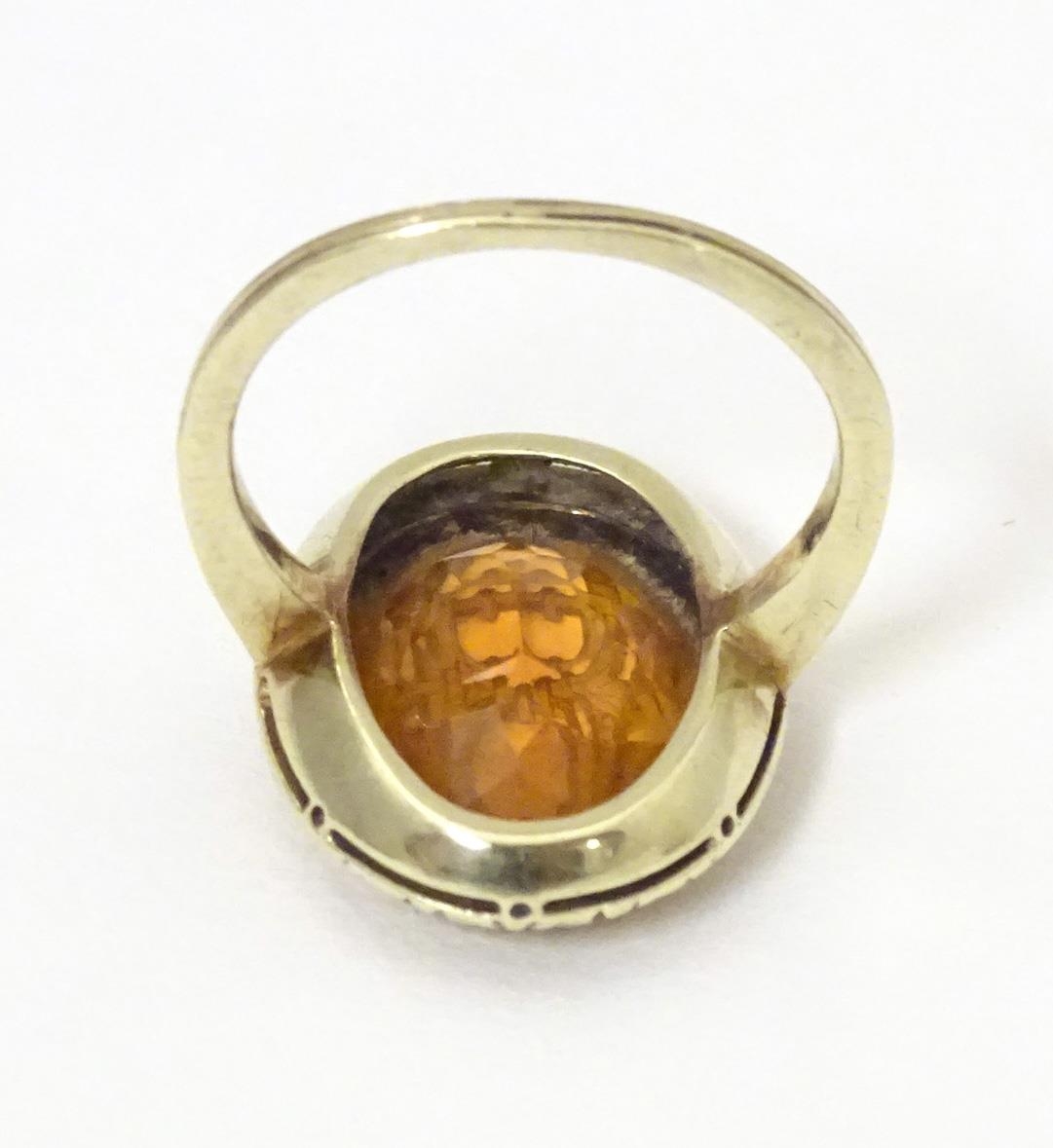 A late 19th / early 20thC yellow metal ring with engraved citrine seal to top depicting monogram. - Image 4 of 6