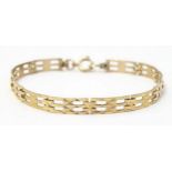 A 9ct gold bracelet with link detail. Approx. 7 1/2" long x 1/4" wide Please Note - we do not make